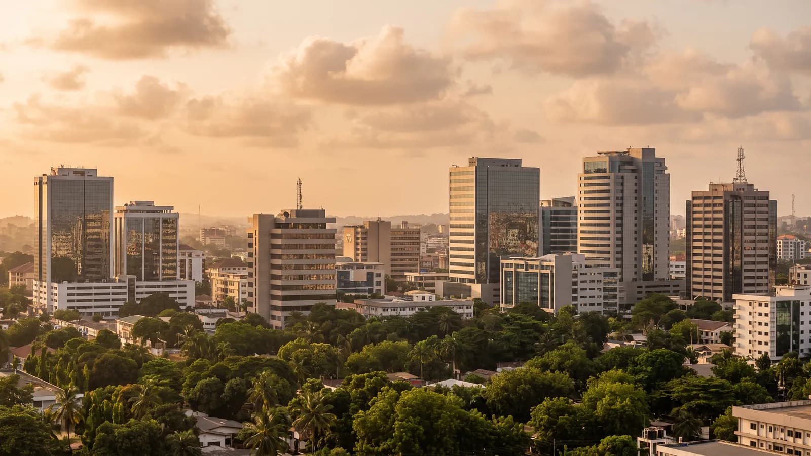 City skyline of modern high-rise towers at golden hour